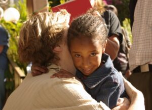 Picture of Millie hugging Kalem, her sponsored child in Ethiopia.